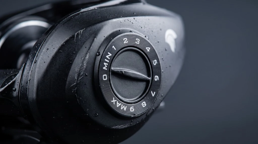 Extreme macro detail of the KastKing Spartacus II Plus magnetic braking dial and palming sideplate