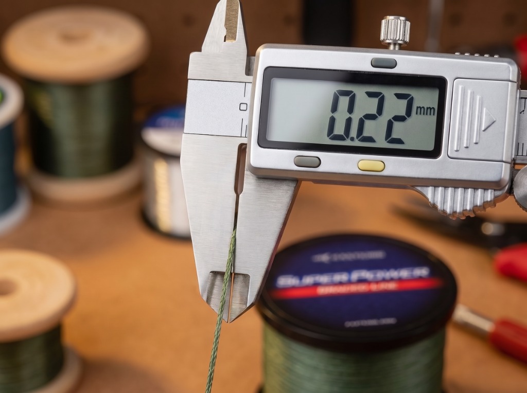 Stainless steel digital micrometer caliper measuring KastKing Superpower braided line diameter at 0.22mm